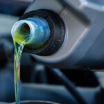 Amsoil Synthetic Oil being poured into a car's engine